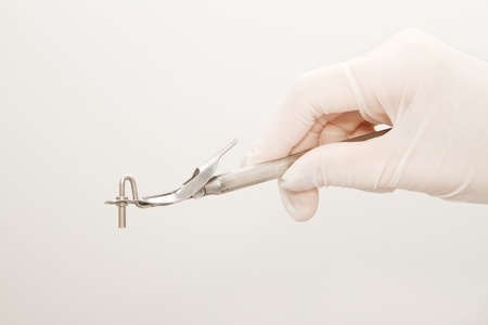 Dentist hand and dental tool in dental clinicの写真素材