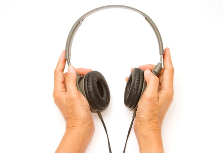  woman hand  with headphones on white backgroundの写真素材