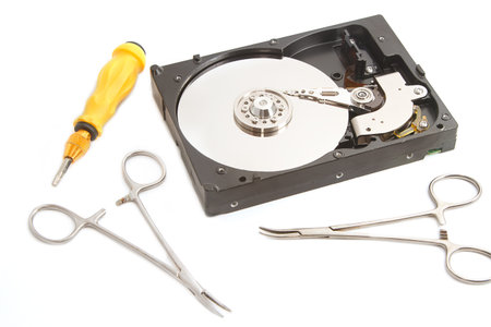 Hard drive with surgery tool ,Hard drive on repairs  data recovery concept