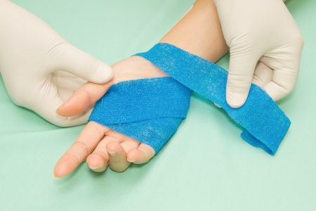 Wound dressing appy medicine bandage on hand injuryの写真素材