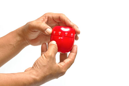 Chef 's hand using apple timer a apple timerの写真素材