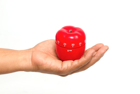 Chef 's hand with a apple timerの写真素材