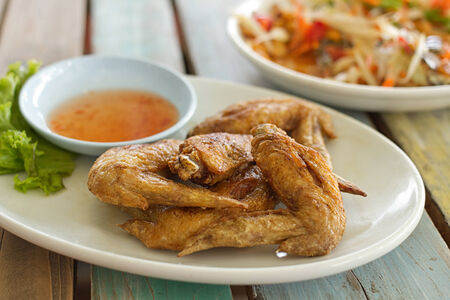 fried chicken on wooden tableの写真素材