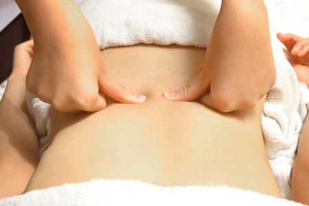 Woman having massage of body in the spa salon