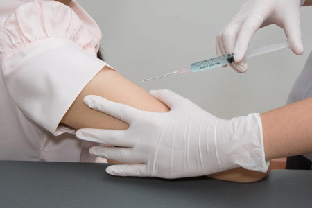 Woman is getting  injection with a syringe at hospital