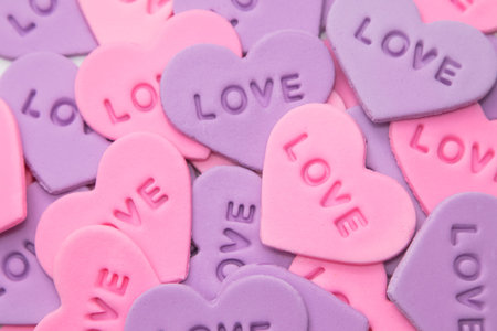Colorful  heart-shaped sprinkles on white