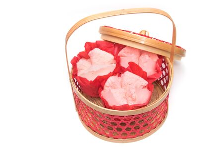 Steamed cupcake with red paper in red basket ,Dessert for chinese new yearの写真素材