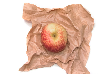 apple is wrapped in the paperの写真素材