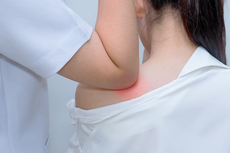 thai massage health care procedure, kneading  shoulders muscles of woman with elbowの写真素材