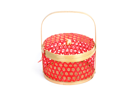 Red wicker basket ,chinese style isolated on white backgroundの写真素材