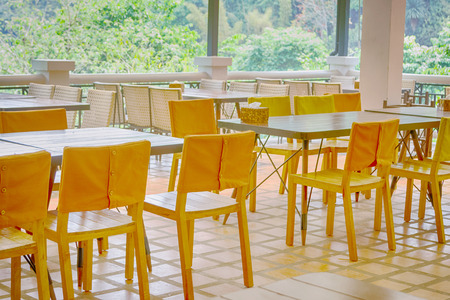 Interior of  restaurant with tables and chairの写真素材