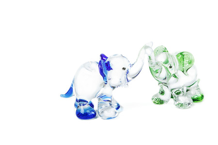 Two glass elephant figurines on white backgroundの写真素材