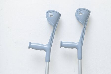 pair of crutches isolated on white backgroundの写真素材