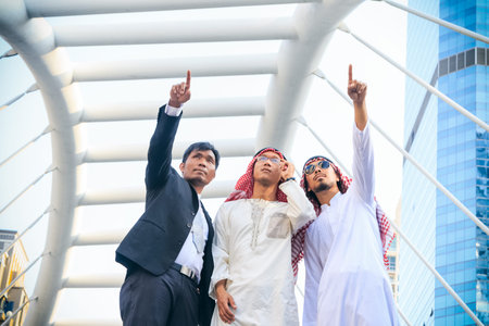 Arab and business man pointing finger on a construction site
