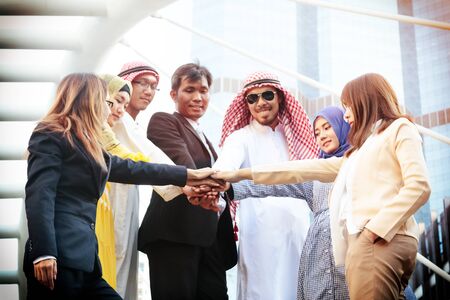 International business team showing unity with their hands togetherの写真素材