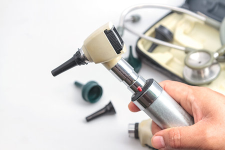  Otoscope, medical instrument on white background.の写真素材