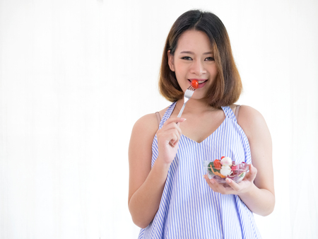 Pregnant woman eating healthy fresh salad,healthy nutrition during pregnancyの写真素材