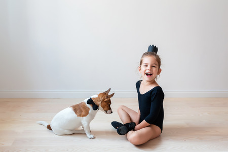 Little ballerina with a dogの写真素材