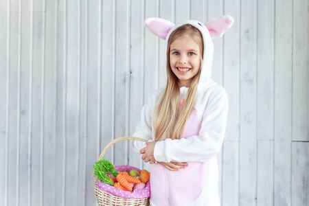 Smiling girl with an Easter basketの写真素材