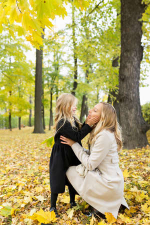 Mother and her daughter are hugging in parkの写真素材
