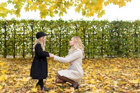 Mother is holding her daughters handsの写真素材