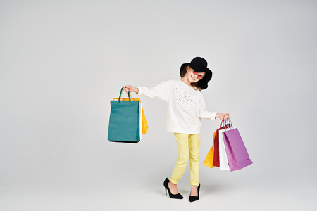 Girl with shoppers bagsの写真素材
