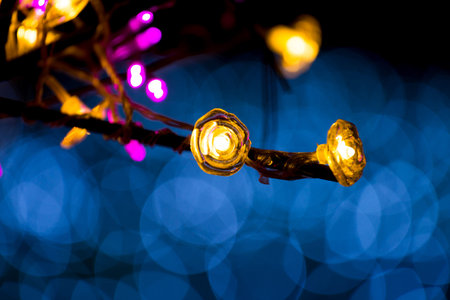 Christmas lights over dark background with copy space and 
out of focus lights during at the night Christmas and New Year.の写真素材