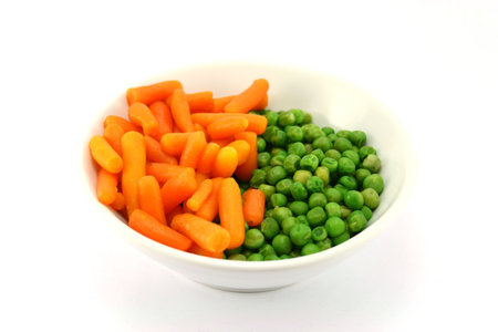 carrots and green peasの写真素材
