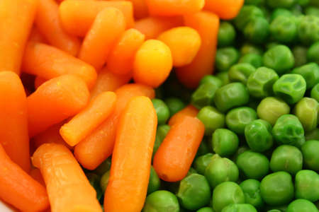 carrots and green peasの写真素材