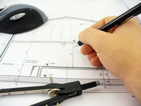 architects hand drawing on blueprints