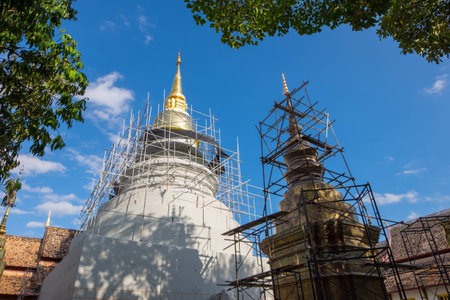 Repairing the pagoda at Wat Phra Sing in Chiang Mai, Thailandの写真素材
