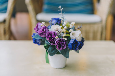 Fake flower on wood tableの写真素材