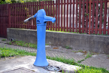 Blue hand water pumpの写真素材