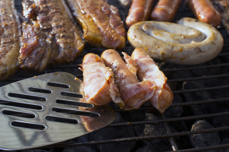 Grilling Meat and Sausage Outside On the Barbequeの写真素材