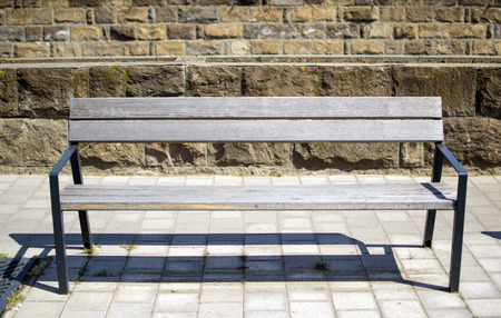 Wooden seat bench in city street Hungary Egerの写真素材