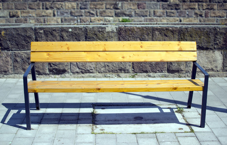 Wooden seat bench in city street Hungary Egerの写真素材