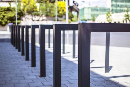 Modern empty square tube bicycle rack in city Eger Hungaryの写真素材