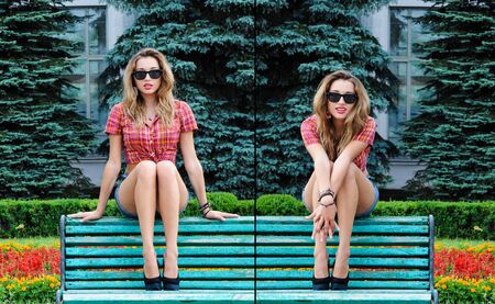 Beautiful summer young girl in old fashion clothes representing pinup and retro style outdoor parkの写真素材