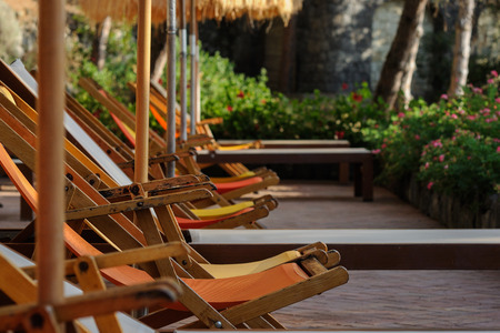 Sunbeds and straw sunshades in Ischia, Italyの写真素材