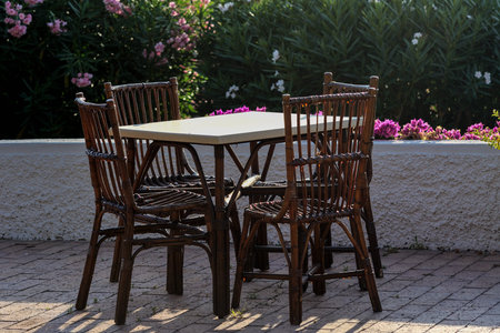 Tables and wicker chairs in the outdoor restaurant in Italy