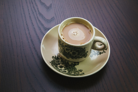 Traditional hainan coffee cup on tableの写真素材