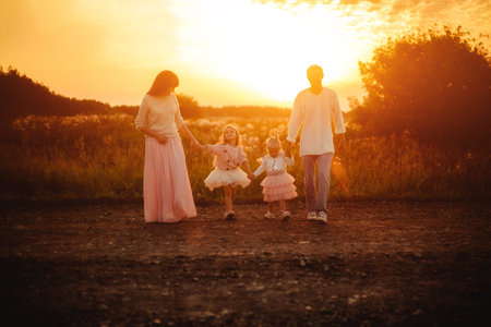 Family with children at sunset