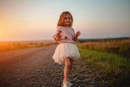 Beautiful little girl in skirtの写真素材