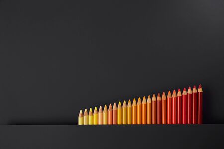 Colour pencils isolated on black background close upの写真素材