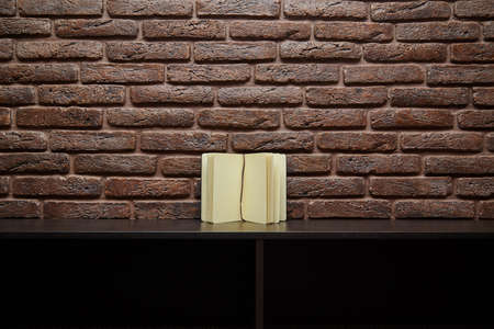 Open sketchbook is on the table. brick wall backgroundの写真素材