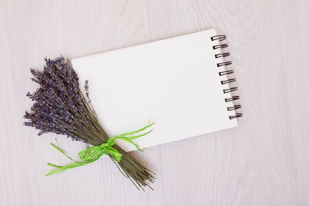 Flowers lavender and empty sketchbook floral frame from dried plants flat lay background. Open sketchbook. notebookの写真素材