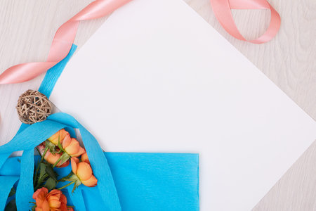 Creative mock up layout made of roses with copy space on table homemade flat lay.