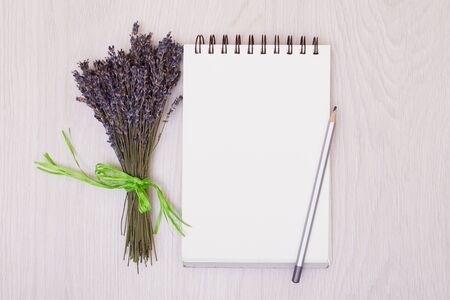 Flowers lavender and empty sketchbook floral frame from dried plants flat lay background.の写真素材