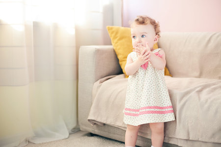 beautiful baby playing in the roomの写真素材