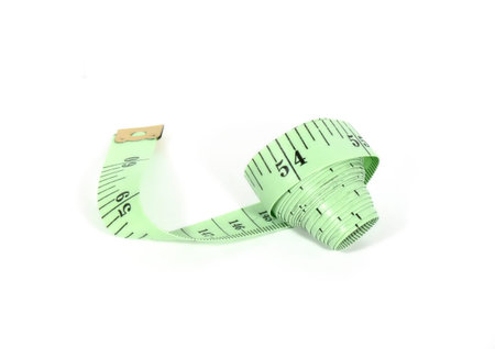 Green tape for measurement of volumes and lengths on a white background